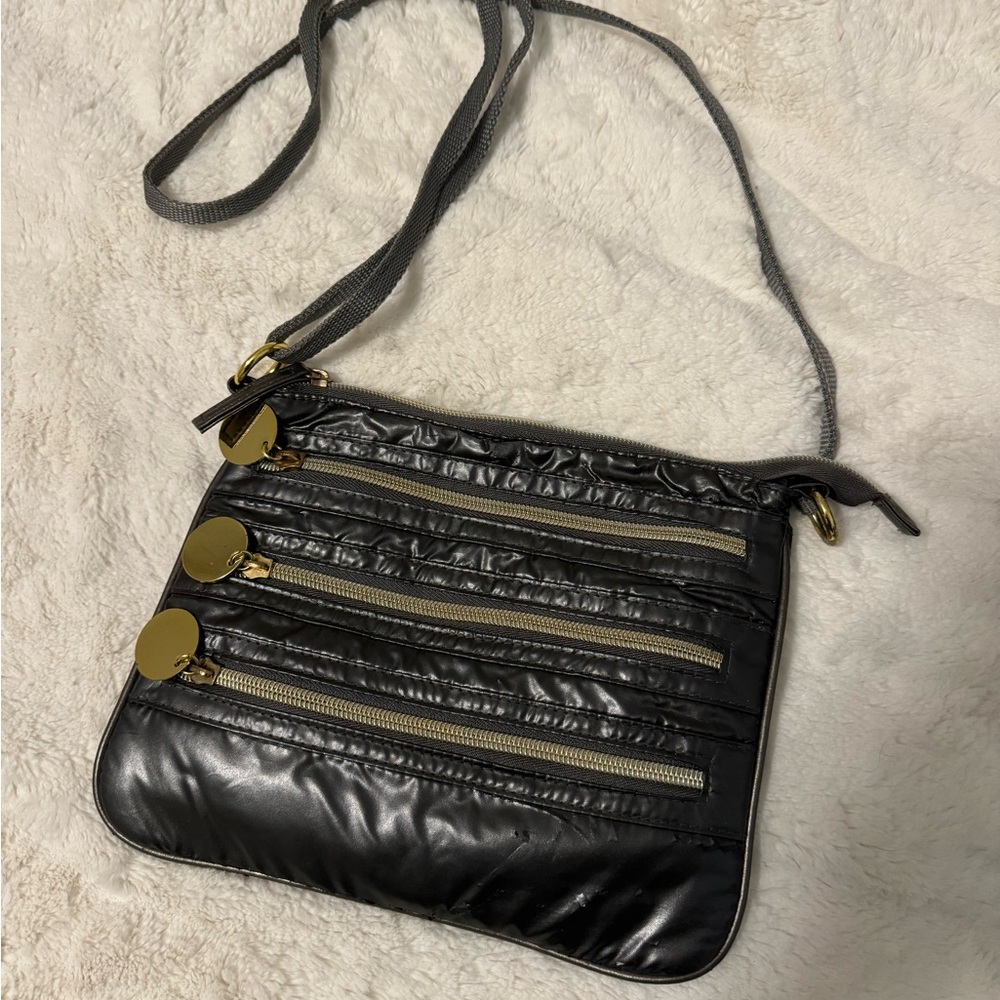 grey and gold crossbody purse w/ four compartments